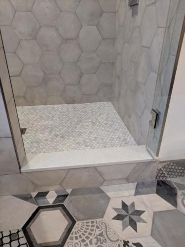 New construction Banff Canmore bathroom open concept patterned mosaic tiles timberframe wood contemporary industrial design steel baseboards