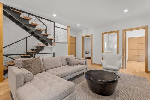 288A Three Sisters Drive downstairs living room with stairwell