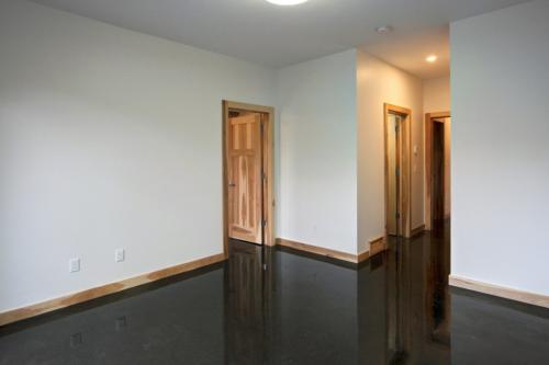 New construction Canmore polished concrete floors hickory trim industrial contemporary design