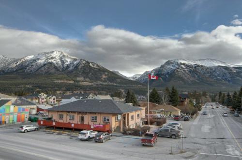 New construction Canmore new construction rooftop deck hickory wood floors glass railings contemporary industrial design 