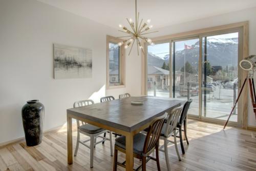 new construction Canmore hickory floors concrete metal dinning room table metal chairs contemporary industrial design 