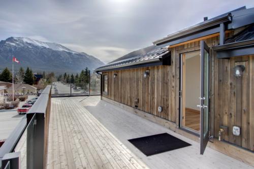 New construction Canmore mountain view deck rooftop deck contemporary industrial design 