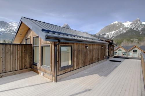 New construction Canmore mountain view deck rooftop deck contemporary industrial design 