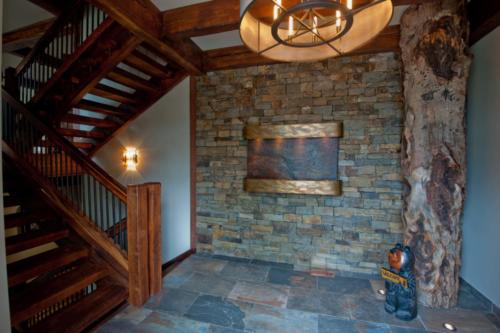 New construction Banff Canmore slate floors timberframe wood stone feature wall wood stairs contemporary industrial design 