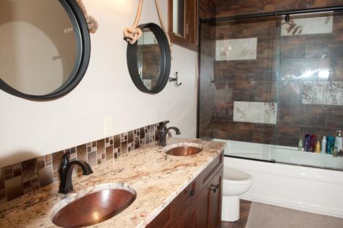 New construction Banff Canmore bathroom wood vanity floors timberframe contemporary industrial design granite counter tops 