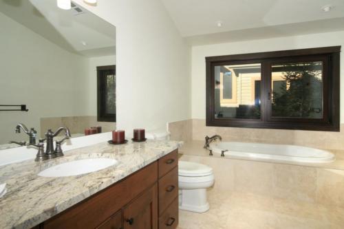 New construction Banff Canmore bathroom open concept hardwood floors timberframe wood contemporary industrial stone counter tops wood vanity 