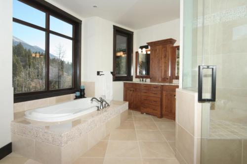New construction Banff Canmore bathroom open concept hardwood floors timberframe wood contemporary industrial stone counter tops wood vanity 