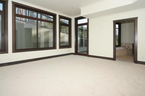 New construction Banff Canmore bedroom open concept hardwood floors timberframe wood contemporary industrial wainscoting walls 