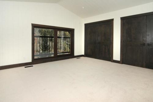 New construction Banff Canmore bedroom open concept hardwood floors timberframe wood contemporary industrial wainscoting walls 