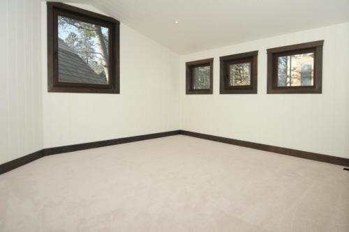 New construction Banff Canmore bedroom open concept hardwood floors timberframe wood contemporary industrial wainscoting walls 