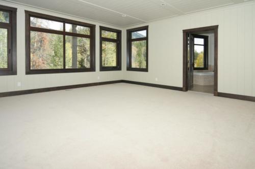 New construction Banff Canmore master bedroom open concept hardwood floors timberframe wood contemporary industrial wainscoting walls 