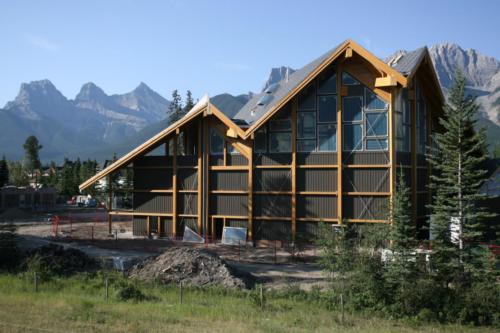 New construction Banff Canmore timberframe commercial brewery open concept wood concrete floors contemporary industrial wood stairs metal railings