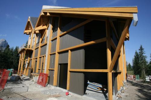 New construction Banff Canmore timberframe commercial brewery open concept wood concrete floors contemporary industrial wood stairs metal railings