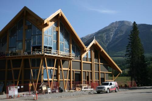 New construction Banff Canmore timberframe commercial brewery open concept wood concrete floors contemporary industrial wood stairs metal railings