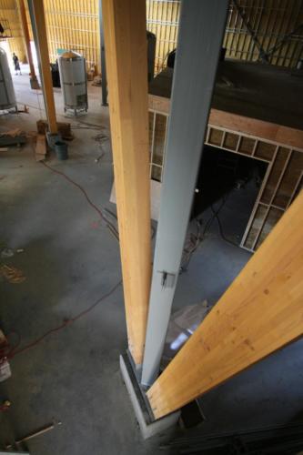 New construction Banff Canmore timberframe commercial brewery open concept wood concrete floors contemporary industrial wood stairs metal railings steel beams