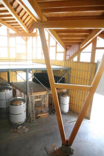 New construction Banff Canmore timberframe commercial brewery open concept wood concrete floors contemporary industrial wood stairs metal railings steel beams