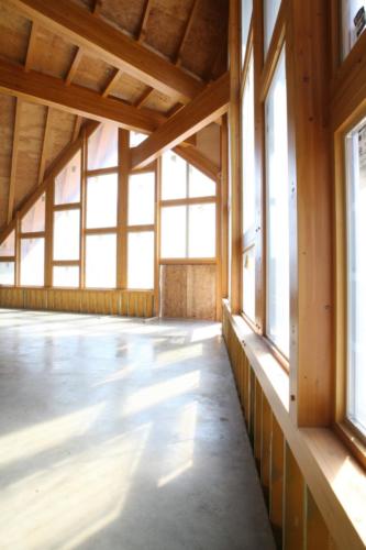 New construction Banff Canmore timberframe commercial brewery open concept wood concrete floors contemporary industrial wood stairs metal railings steel beams
